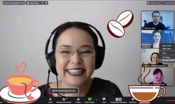 Young woman with headphones, doing activities with colleagues on a Zoom call.