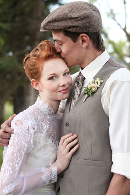 a vintage inspired groom's look with a grey waistcoat, cap, a striped tie and a white shirt