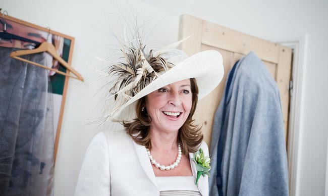 Lady wearing hat - The 12 Golden Rules of Wedding hat Etiquette