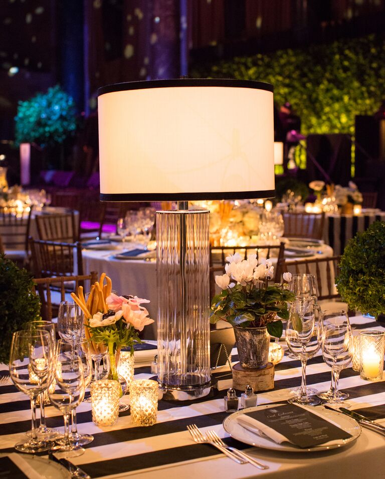 Glamorous wedding reception with modern lamp centerpieces