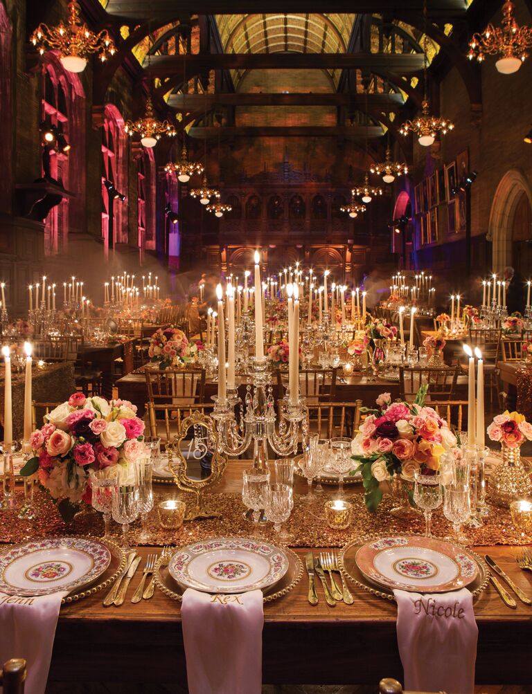 Dramatic wedding reception with tall taper candles
