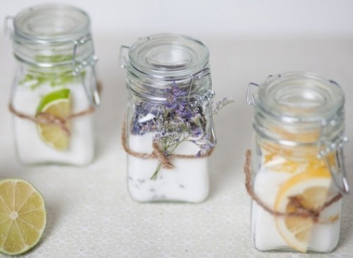 bath salts with various essential oils in jars and slices and herbs attached is a very relaxing kind of favor