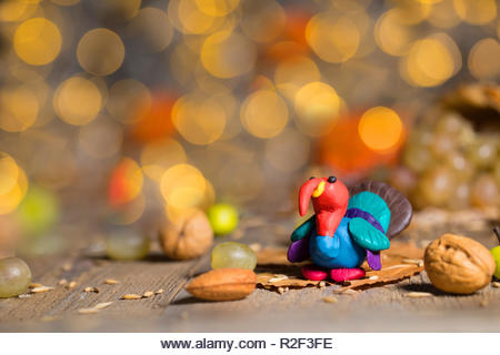 Handmade turkey on Thanksgiving background with blurred night lights. Closeup - Stock Image