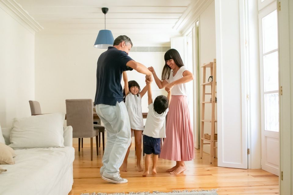 mother and father standing in a circle with daughter and son