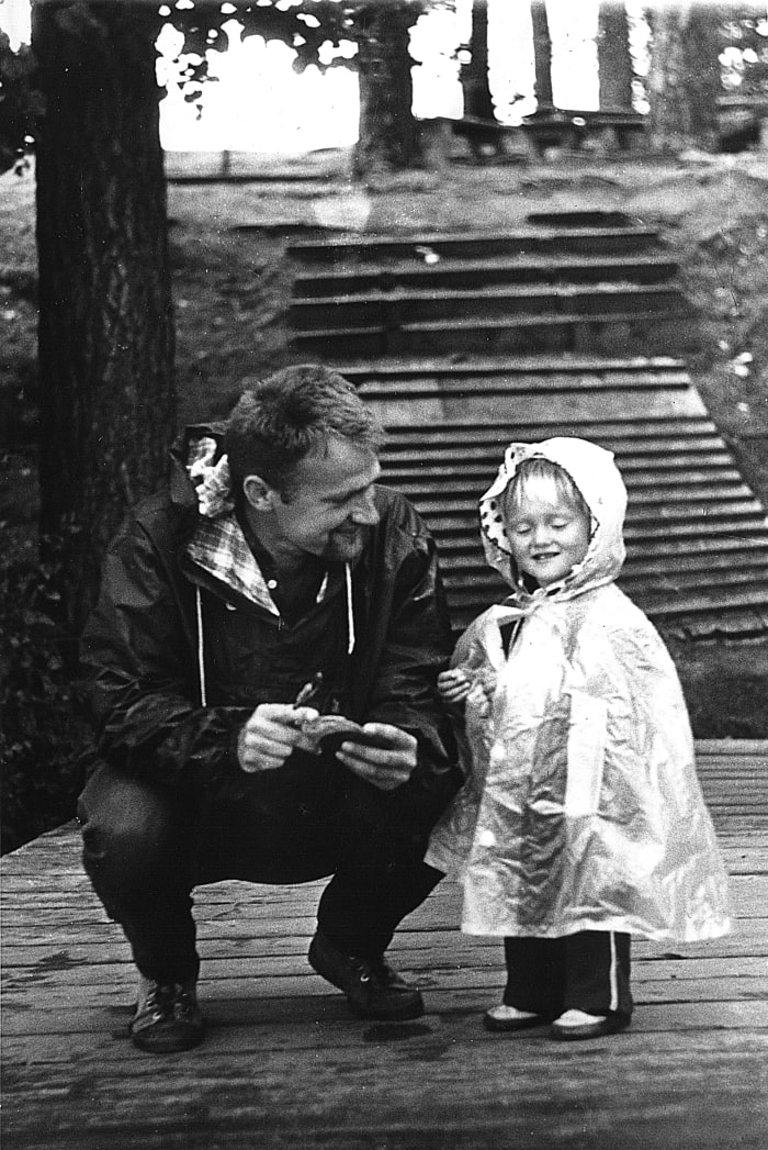 A Black and White Still of a Father and Child