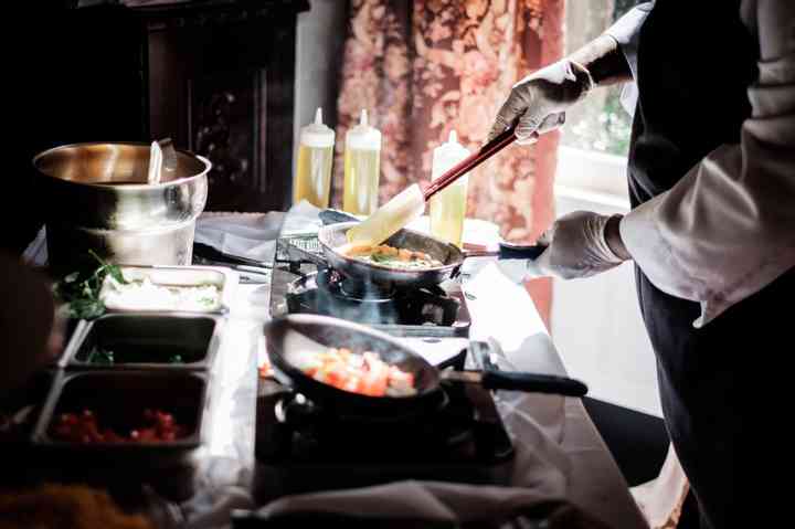 chef preparing food for brunch wedding