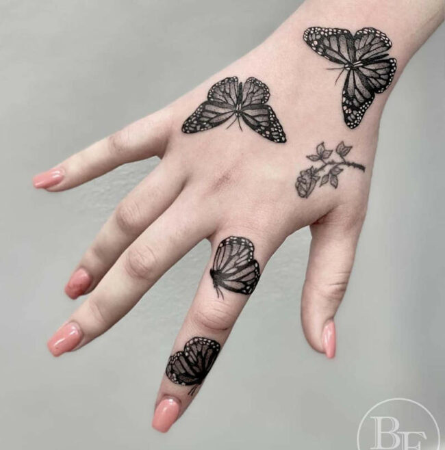 butterfly tattoo on arm to hand