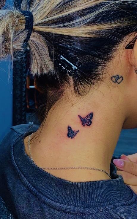 red butterfly tattoo behind ear