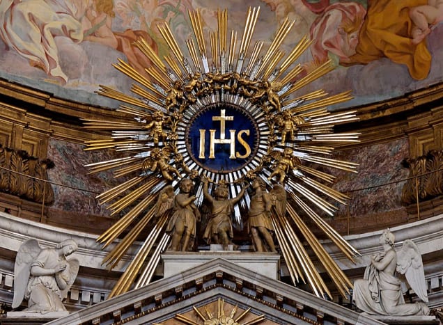 IHS monogram at the top of the main altar at Ges&ugrave; in Rome, Italy.