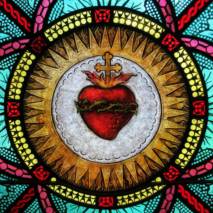 Stained glass of the Sacred Heart at All Saints Catholic Church.