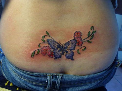 small butterfly tattoo lower back