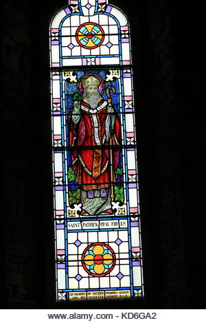 Saint Patrick. Stained glass windows in Catholic Church in Co. Kerry, Ireland. Paintings. - Stock Image