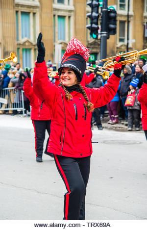 Marching band with uniform parading in the Saint Patrick Day in Montreal downtown - Stock Image