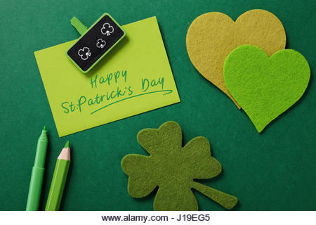 happy st patrick day writing on a card - Stock Image