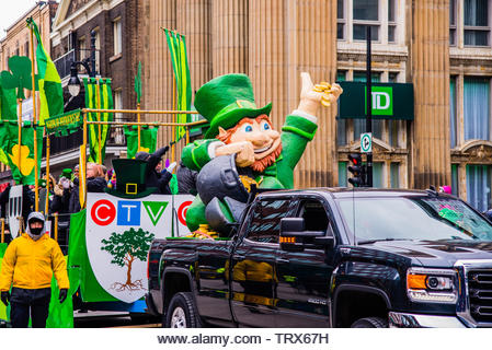 People celebrating the Saint Patrick`s Day Parade in Montreal downtown - Stock Image