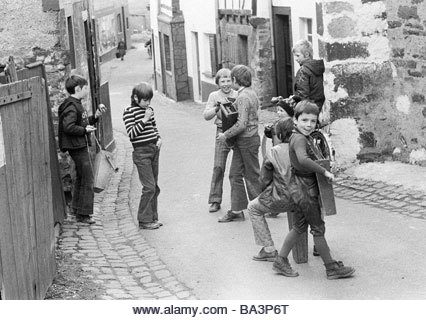 Seventies, black and white photo, people, children, little boys with a ratch or rattle, aged 4 to 12 years, Easter - Stock Image