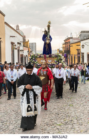 Catholic devotees carry a statue of Jesus during the Las Cruzes del Señor Golpe procession through the streets as part of Holy Week March 28, 2021 in San Miguel de Allende, Mexico. The event is recreation of the passion of Jesus Christ on his way to Calvary for crucifixion. - Stock Image