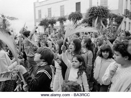 Eighties, black and white photo, Easter, Passion Week, Palm Sunday 1981, church parade, children wave palm branches, - Stock Image