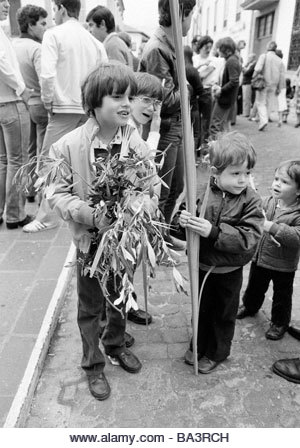 Eighties, black and white photo, Easter, Passion Week, Palm Sunday 1981, church parade, children holding palm branches - Stock Image