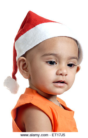 Indian baby boy child in Christmas party red Santa Claus cap - MR#152 - RMM 150208 - Stock Image