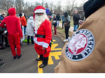 Pennsylvania, USA. 21st Dec, 2021. Matt Johnson (Santa) stands by as gifts are handed out as members of the Delaware Valley Iron Indian Riders Association held their annual Ride Of the Santas and dropped off toys to children at  Saturday, December 21, 2021 at St Francis-St Vincent Home For Children in Bensalem, Pennsylvania. Credit: William Thomas Cain/Alamy Live News - Stock Image