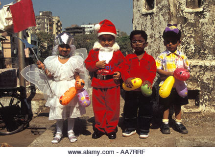 Young Indian children dressed up to celebrate Christmas in India, Mumbai, South India - Stock Image