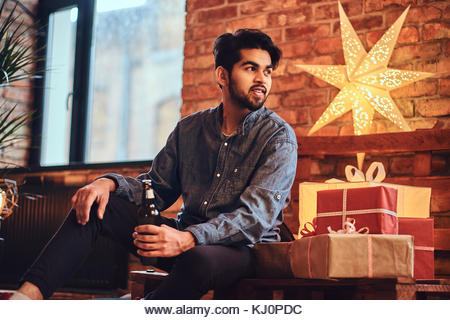 A man drinks beer. - Stock Image