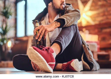 A man drinks beer. - Stock Image