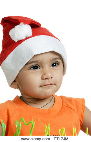 Baby wearing Santa Claus cap MR#152 - Stock Image