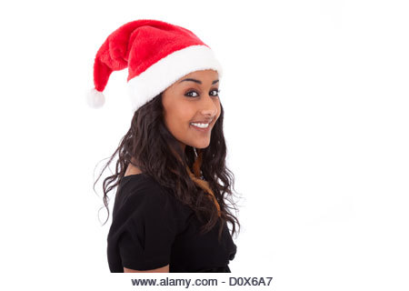 Young African American woman wearing a santa hat, isolated on white background - Stock Image