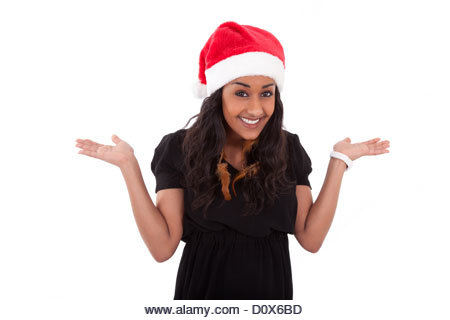 Young African American woman wearing a santa hat, isolated on white background - Stock Image