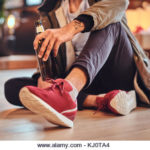 A man drinks beer. - Stock Image