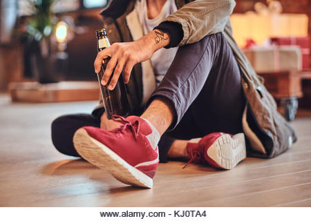 A man drinks beer. - Stock Image