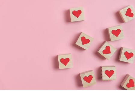 High Angle View Of Heart Shape Blocks On Pink Background - Stock Image