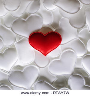 Red textile heart on white hearts background. Valentines day texture and love concept - Stock Image