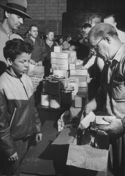 Vintage father and son serving soup in the kitchen.