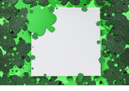 Happy St Patrick's day. Blank canvas over a green background with clover. - Stock Image
