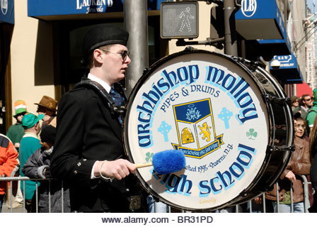 Drummer Boy in Archbishop Molloy Pipes & Drums High School Band marching in St. Patrick's Day Parade, March - Stock Image
