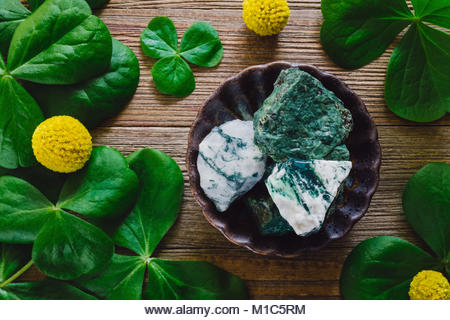 Stones and Elements of St. Patrick's Day, Including Shamrocks, Green Aventurine and Tree Agate. - Stock Image