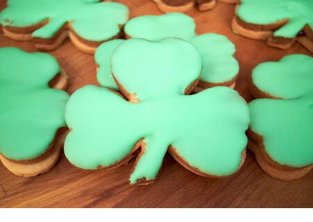 shamrock shaped biscuits produced to celebrate st patricks day in ireland - Stock Image