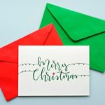 Top view hand drawn Christmas greeting cards with envelope.